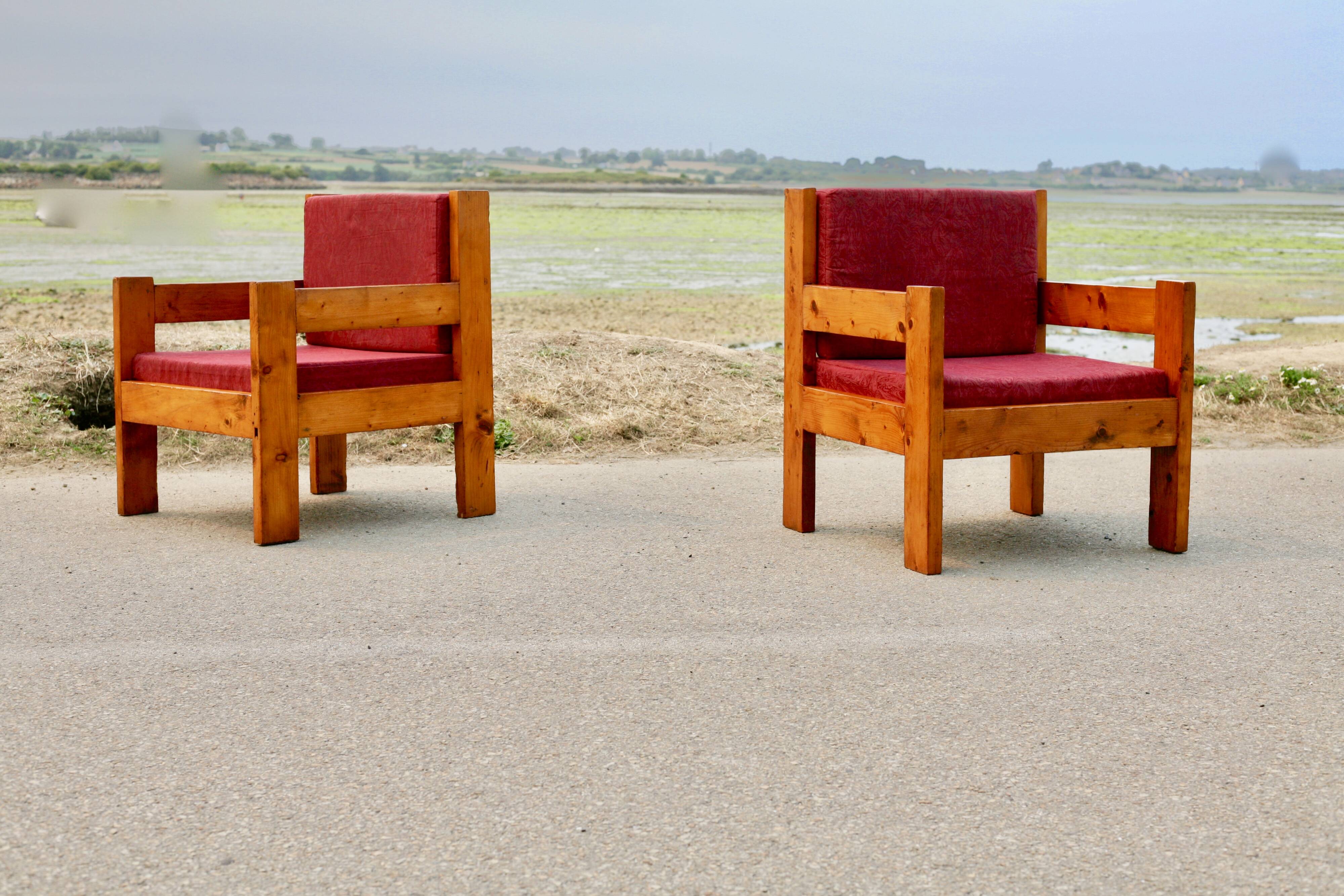 Pair of pine fireside chairs, France, 1960s, "raspberry" cushions