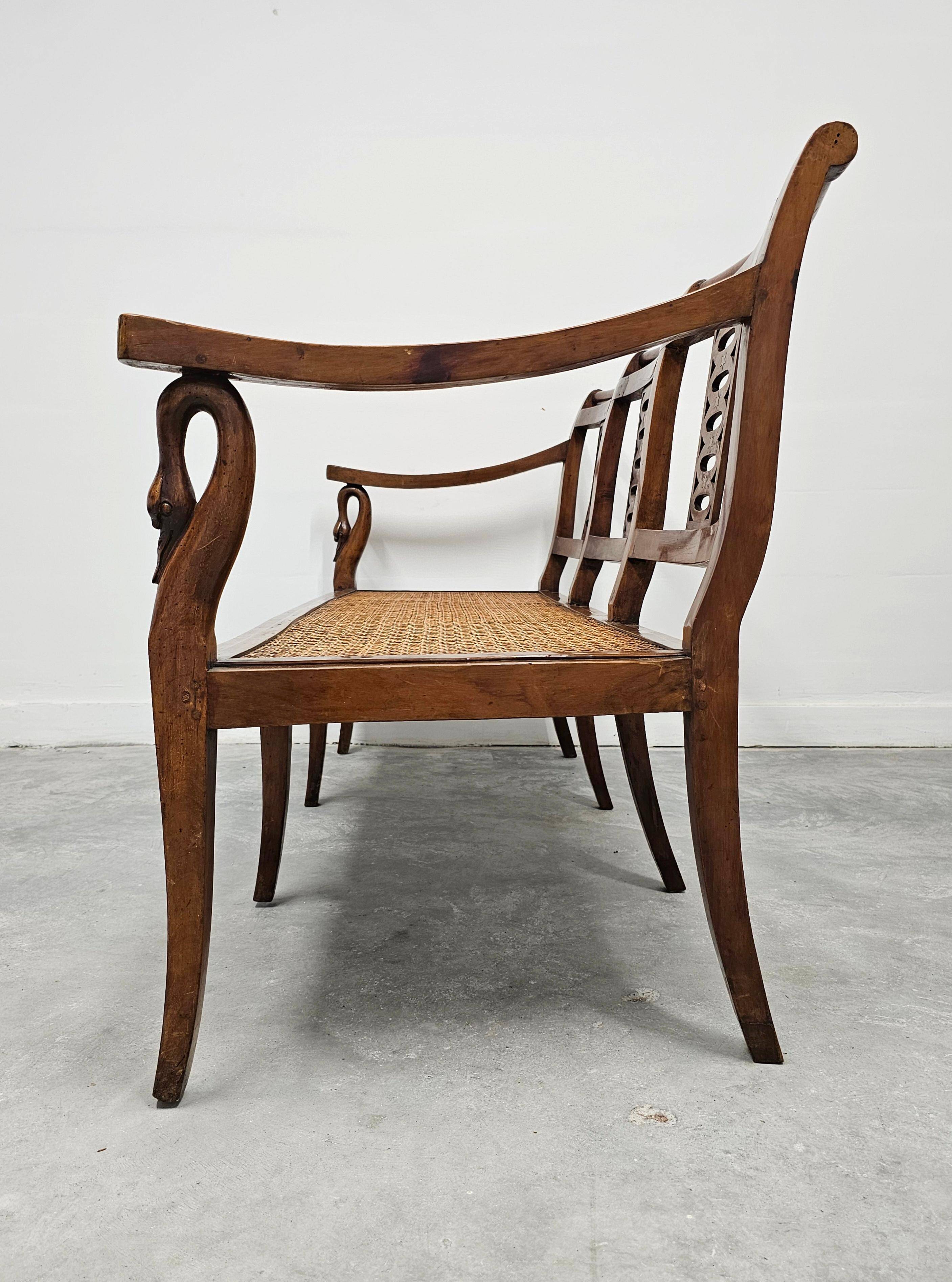 Directoire canapé in walnut with brass inlays, late 18th century.