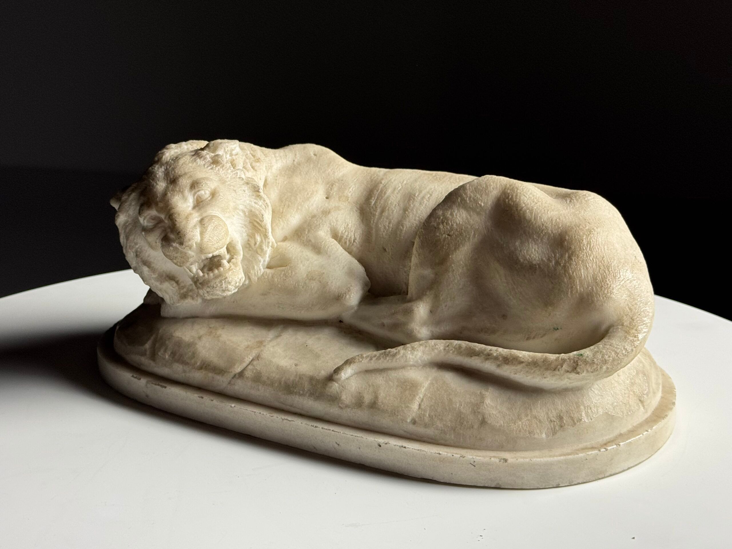 Marble sculpture of a reclining lion