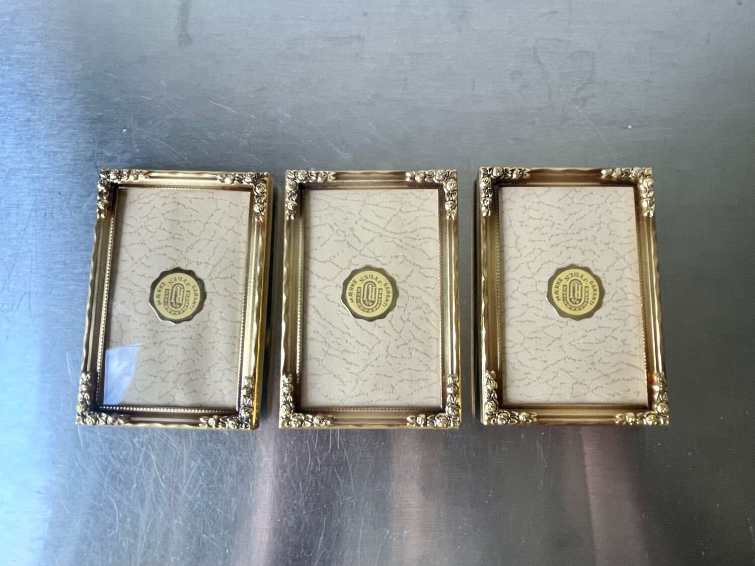 Set of 3 vintage identical gold colored metal picture frames convex glass