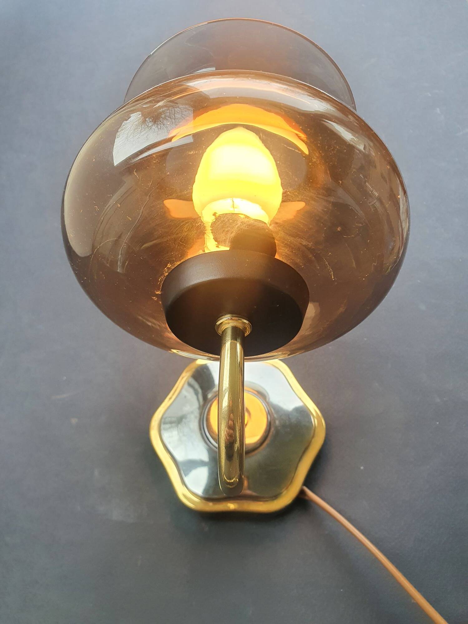 Pair of antique gold-plated brass and smoked glass wall lights.