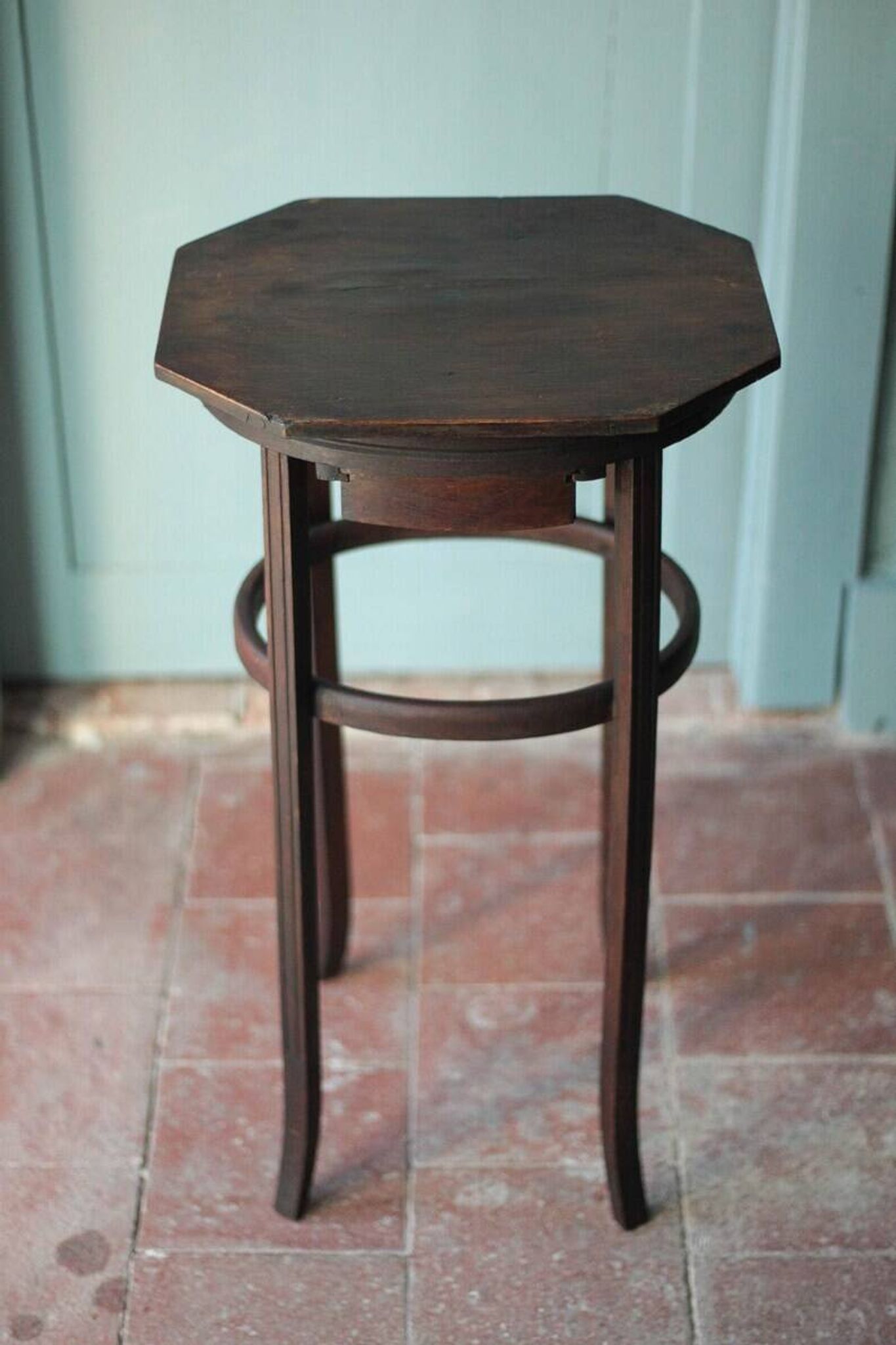Wooden drawer table or 19th-century work table with a curved wooden stretcher, in the style of Thonet, circa 1900-1920.