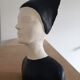 Bust of a woman in anthracite and white plaster