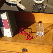 Vintage oak bedside table with tapered legs.