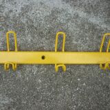 Yellow metal wall coat holder