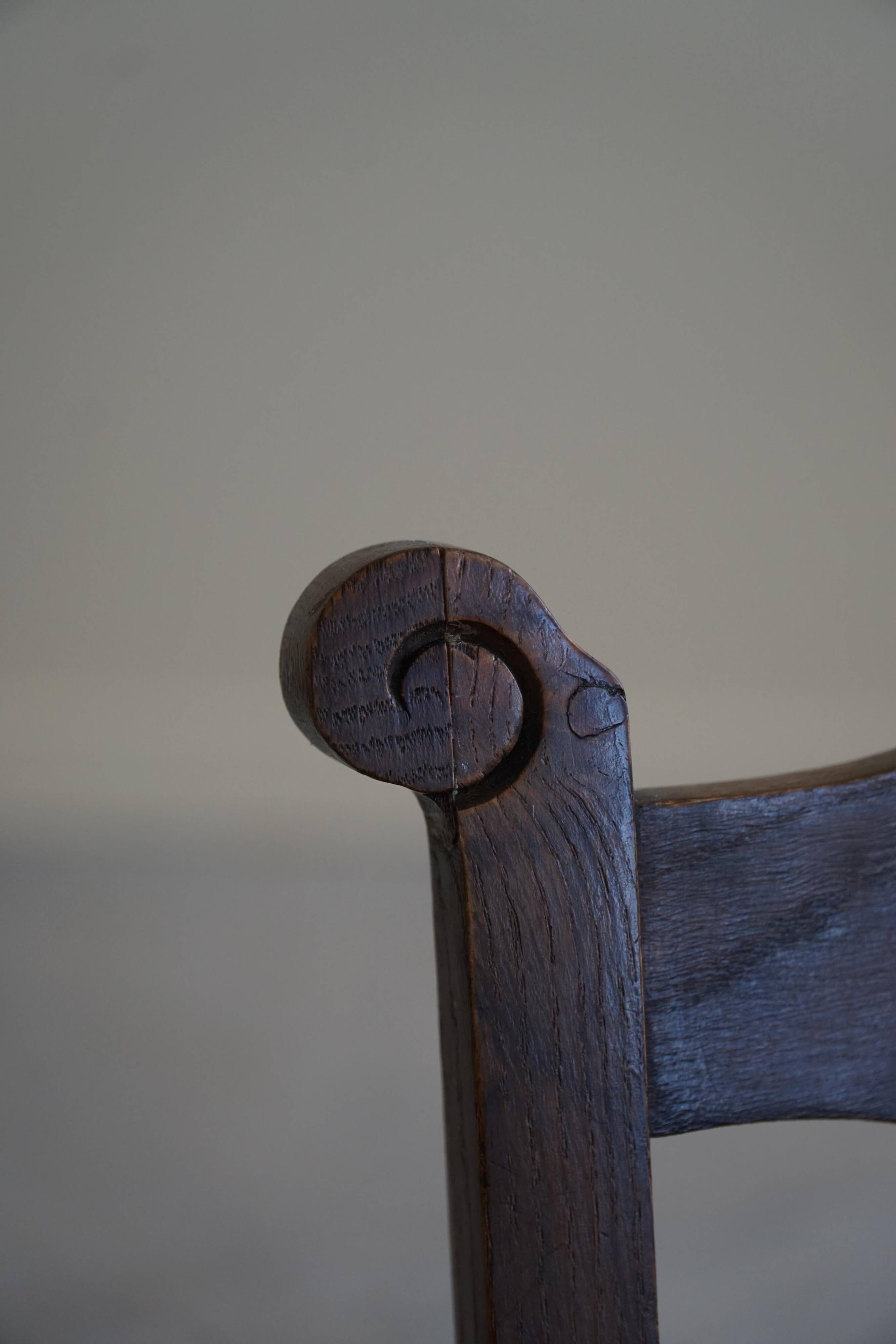 A pair of modern and sculptural vintage Danish armchairs in oak and papercord, 1940s.