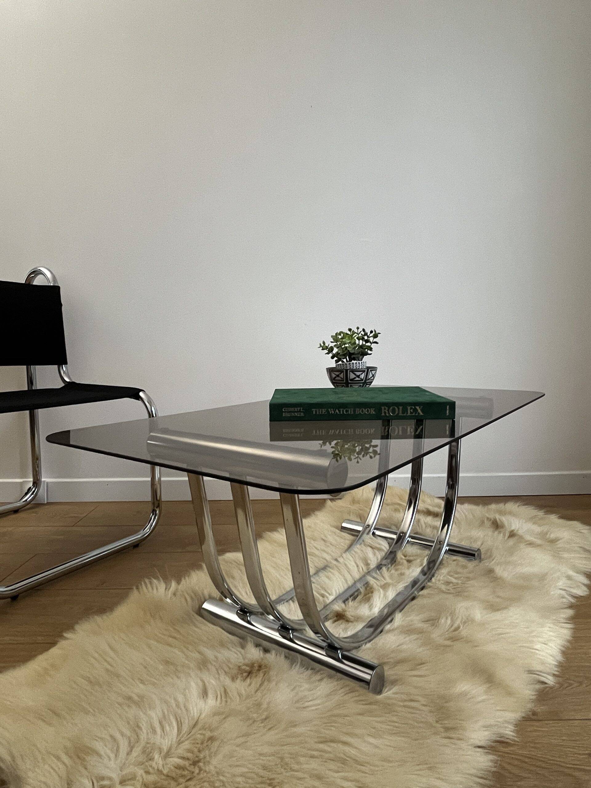 Smoked glass coffee table and chrome base by Yves Boutboul