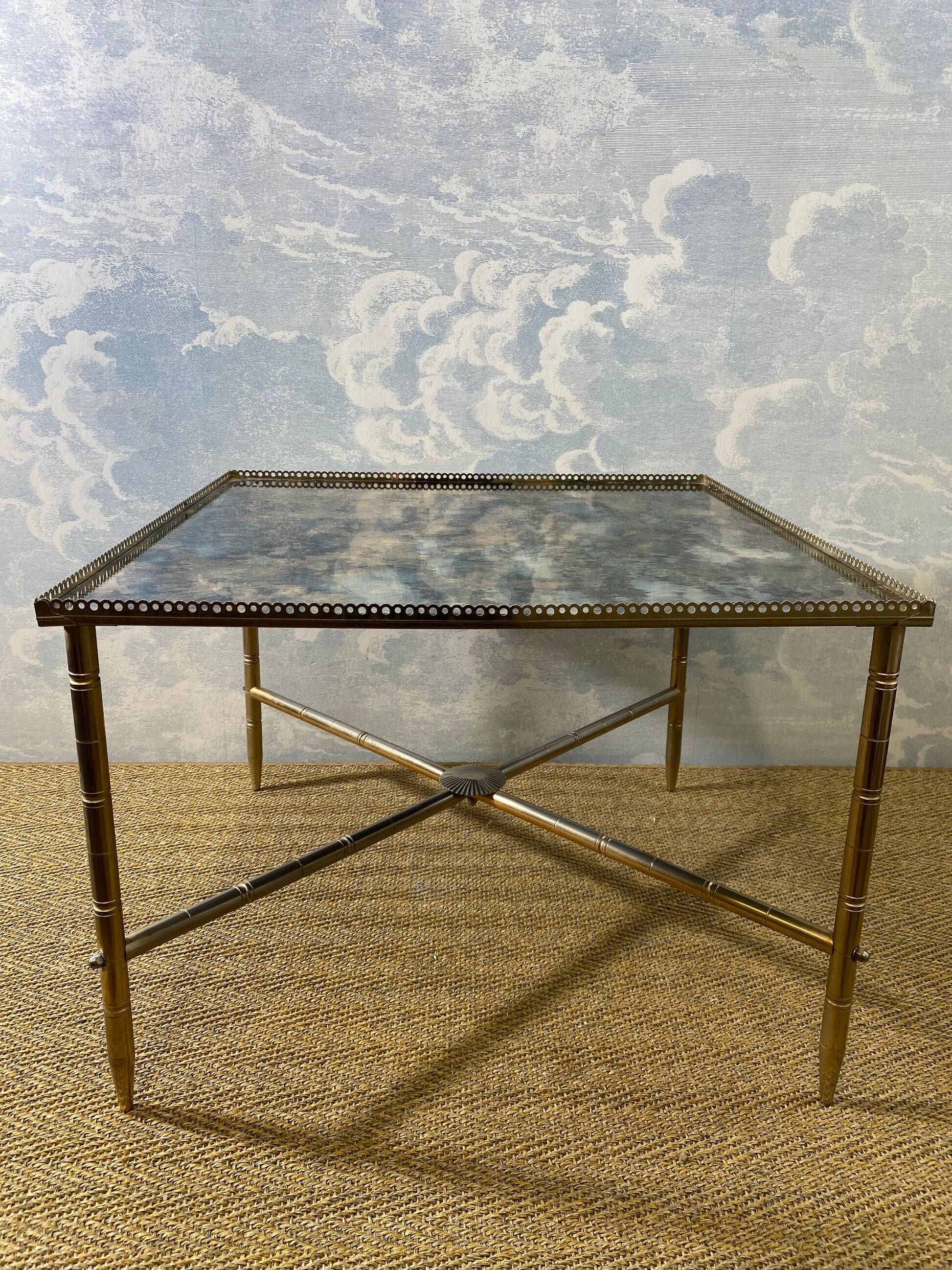 Side table with oxidised metal mirror top on a brass frame, France, 1960s.
