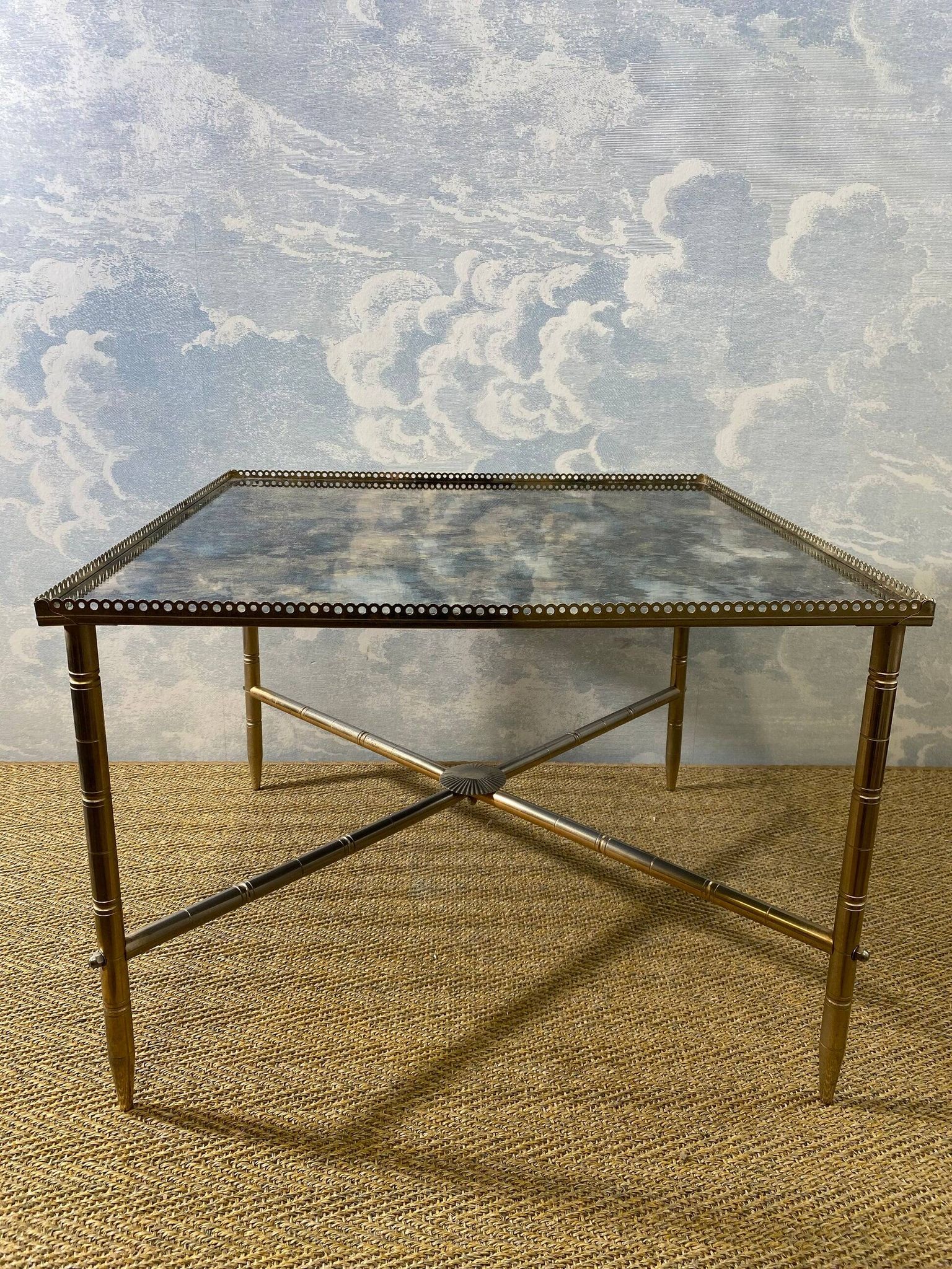 Side table with oxidised metal mirror top on a brass frame, France, 1960s.
