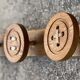 Vintage 1980 coat rack with 3 "button" hooks.