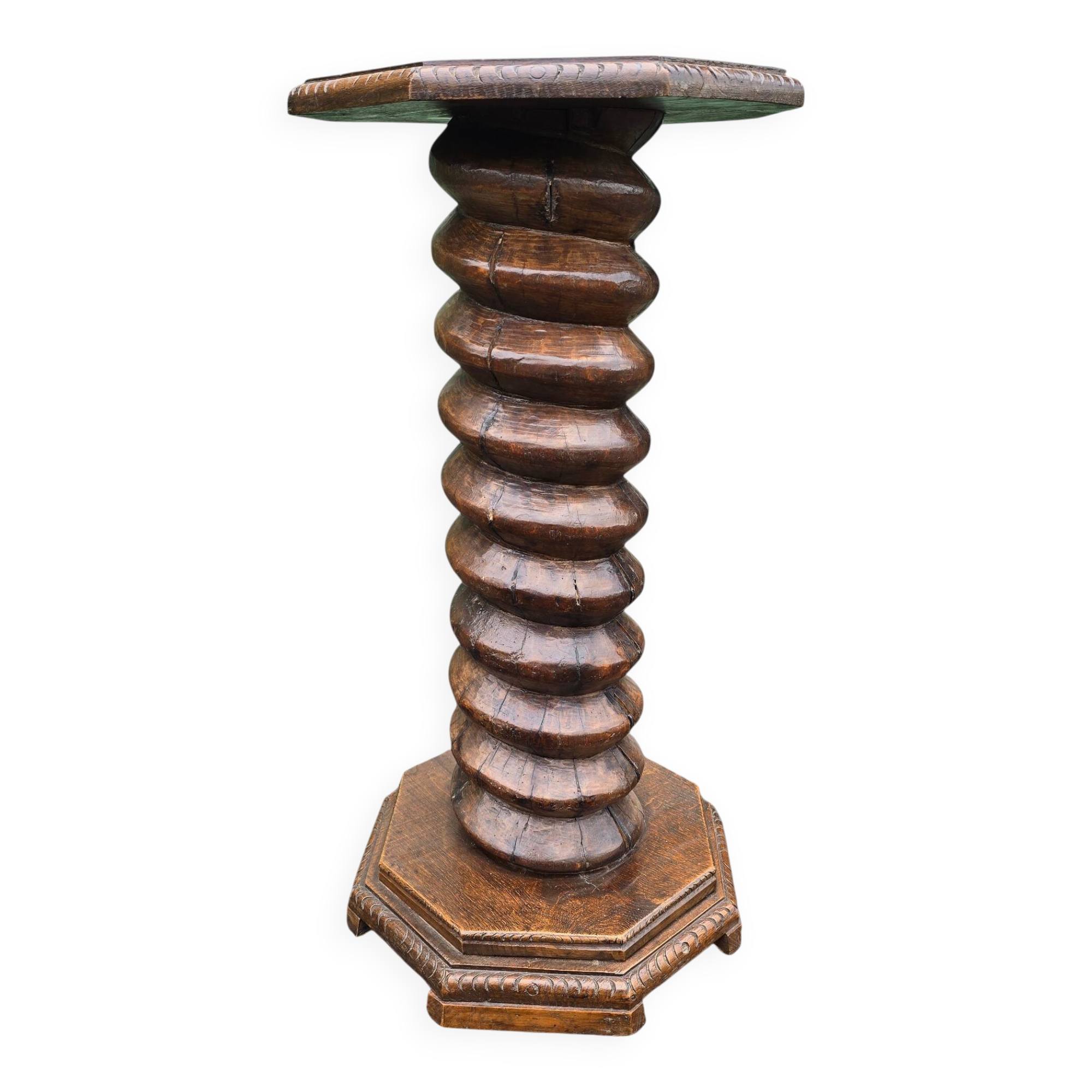 Antique carved solid oak pedestal, octagonal top and turned column.