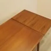 Danish extendable dining table, teak veneer, solid wood legs, leaf storage, 1970s