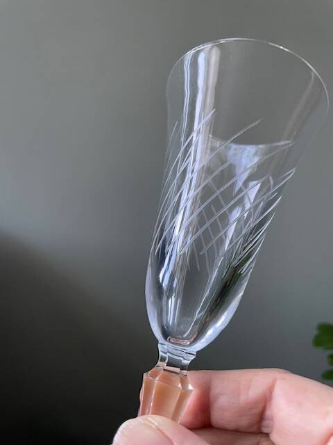 2 antique blown glass champagne flutes, tulip shape.