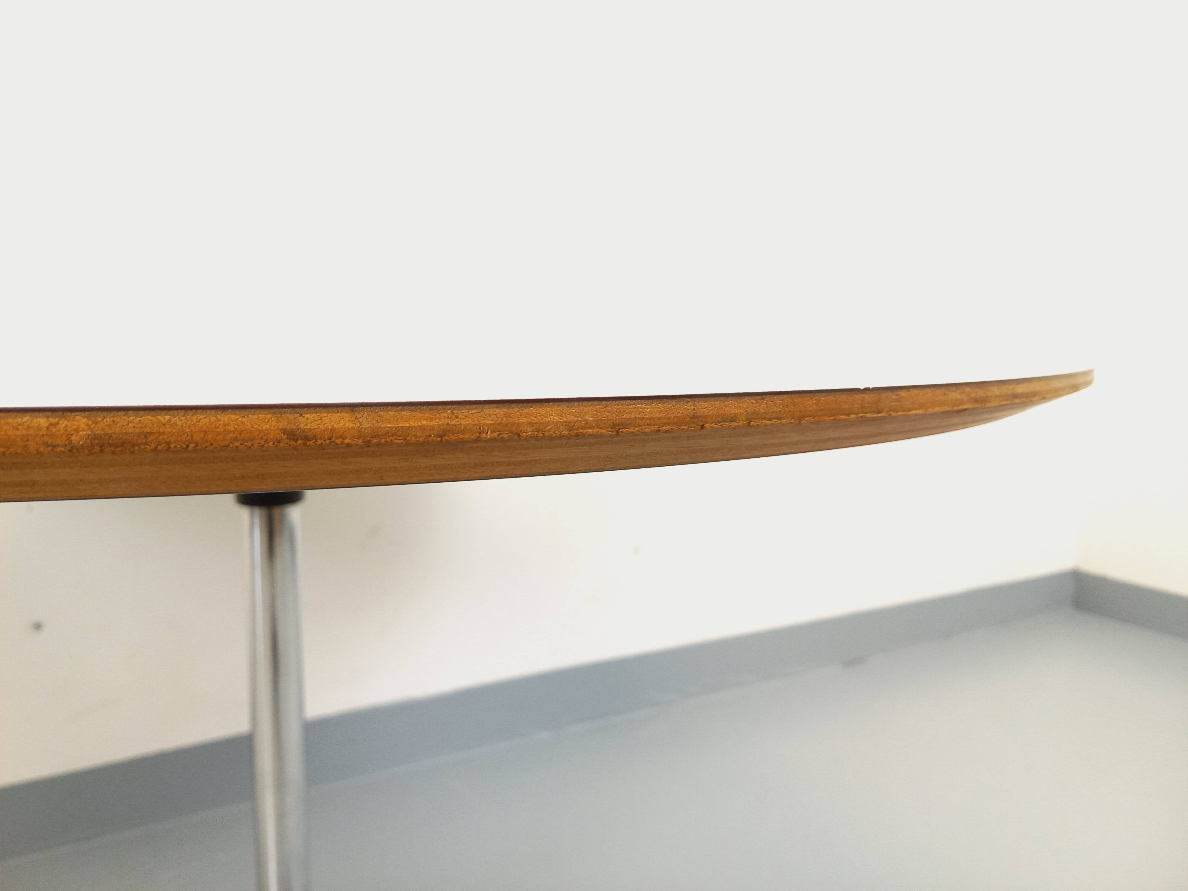 Vintage Eames round table for Vitra in white melamine, wood, and metal.