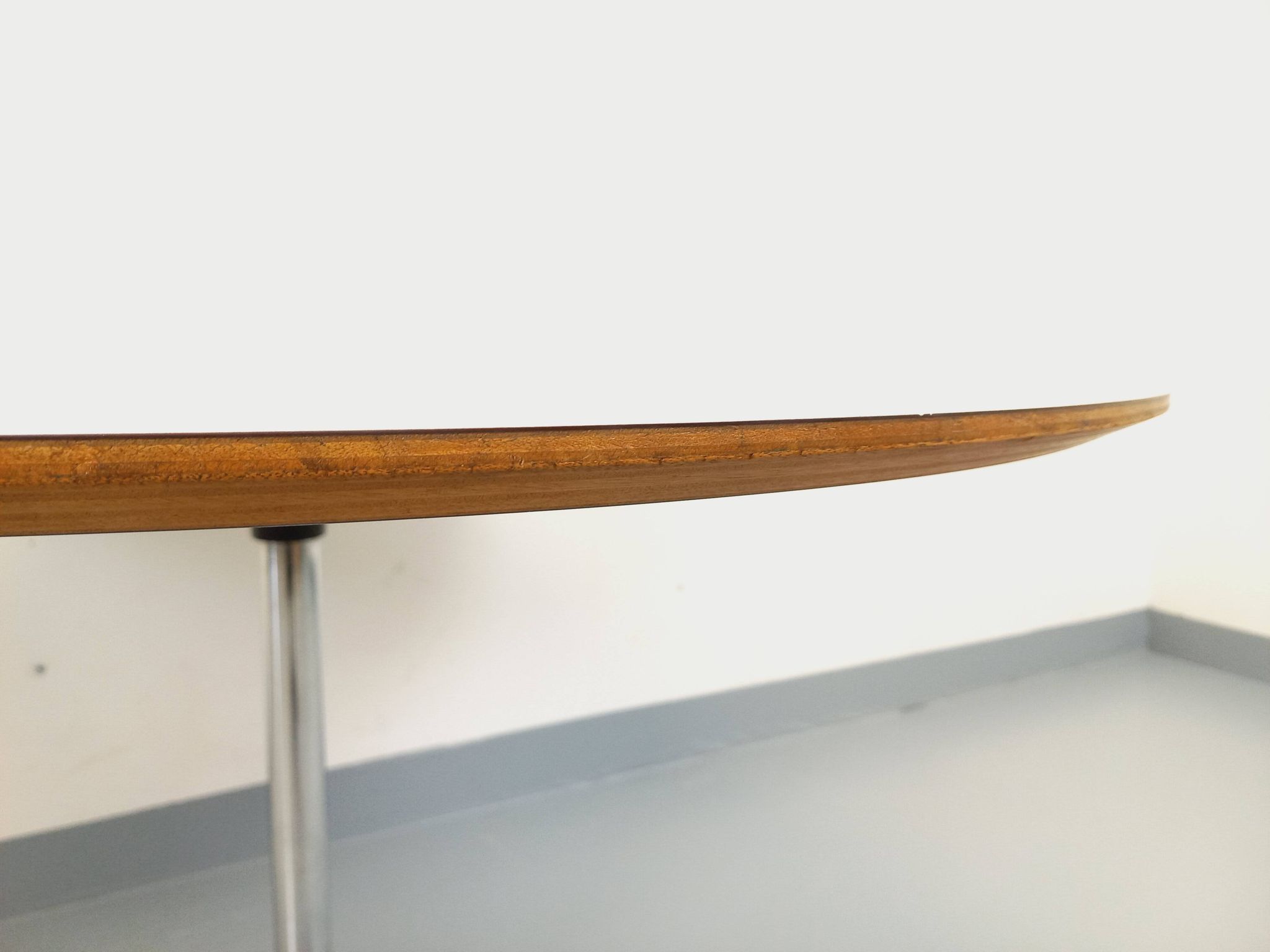 Vintage Eames round table for Vitra in white melamine, wood, and metal.