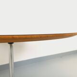 Vintage Eames round table for Vitra in white melamine, wood, and metal.