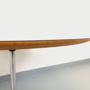 Vintage Eames round table for Vitra in white melamine, wood, and metal.