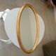 Miroir vintage ovale en bois doré années 60 77*41 cm
