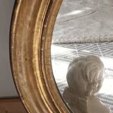 Antique oval gilded stucco mirror