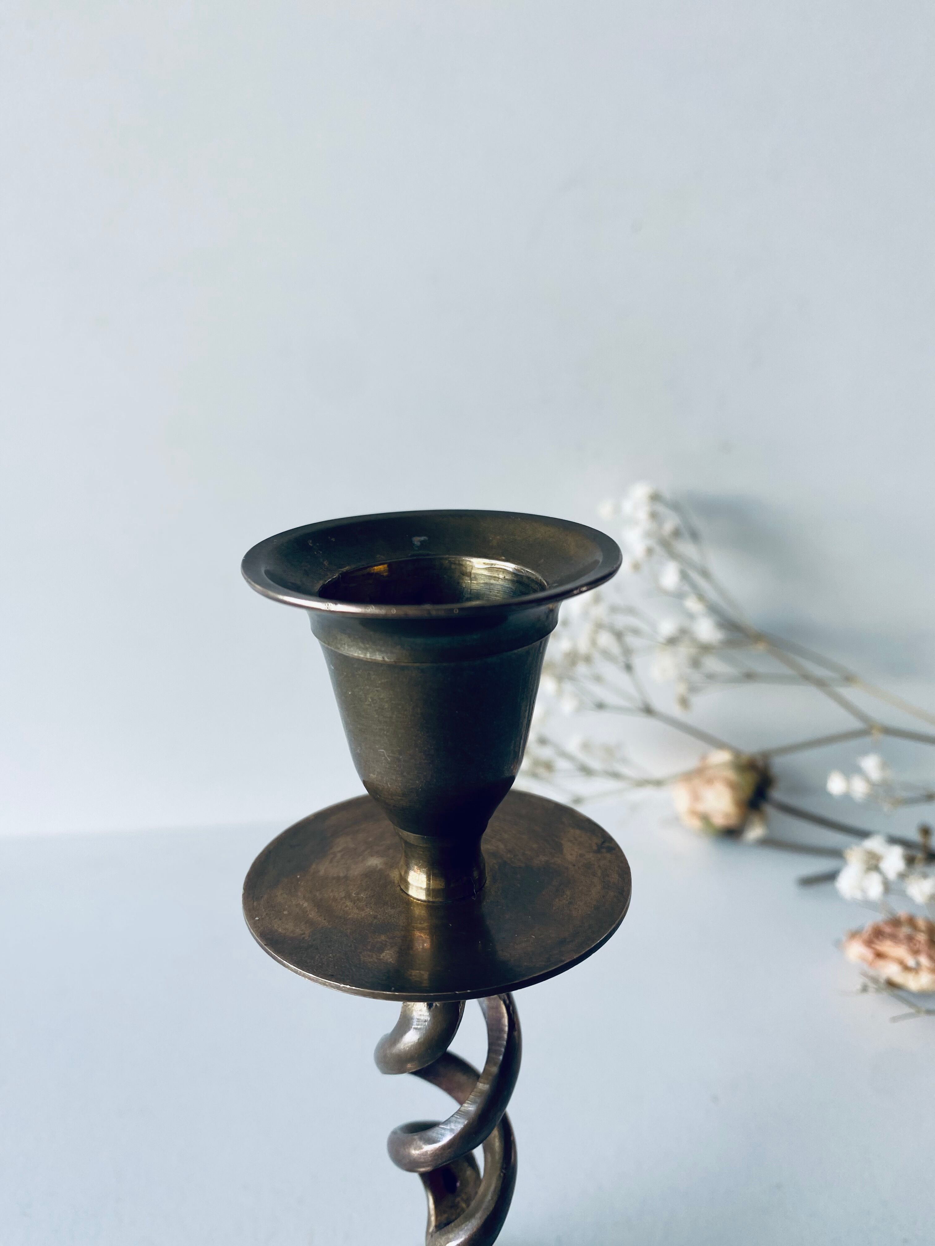 Twisted brass candle holder