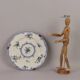 Antique earthenware plates with floral decoration from the 19th century.