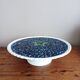 Pie dish on foot, in slip with blackberry decoration