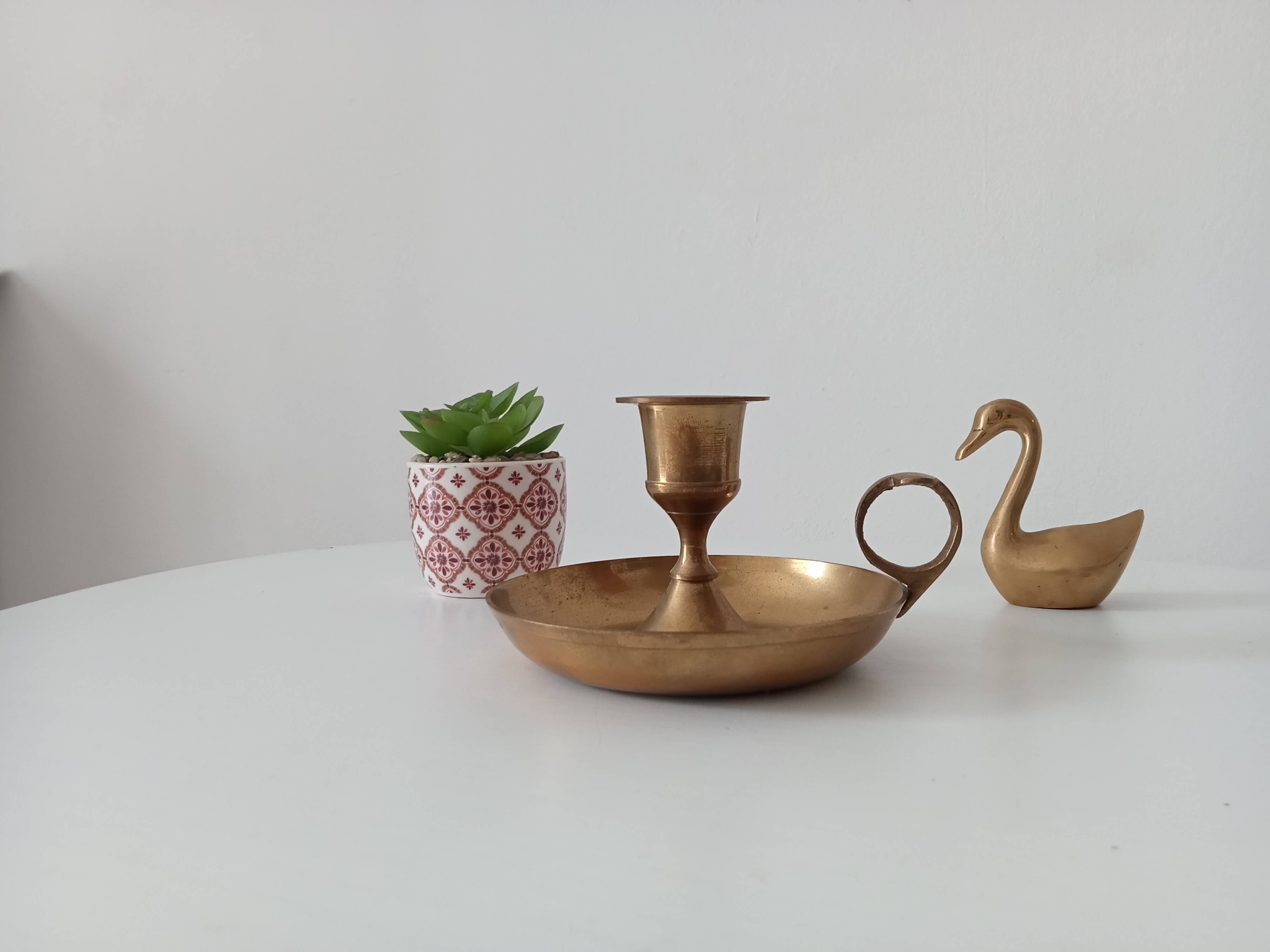 Vintage golden brass hand candle holder