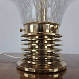 1970s table lamp in worked glass and gold metal