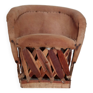 Mexican equipale chair for children in leather and wood.