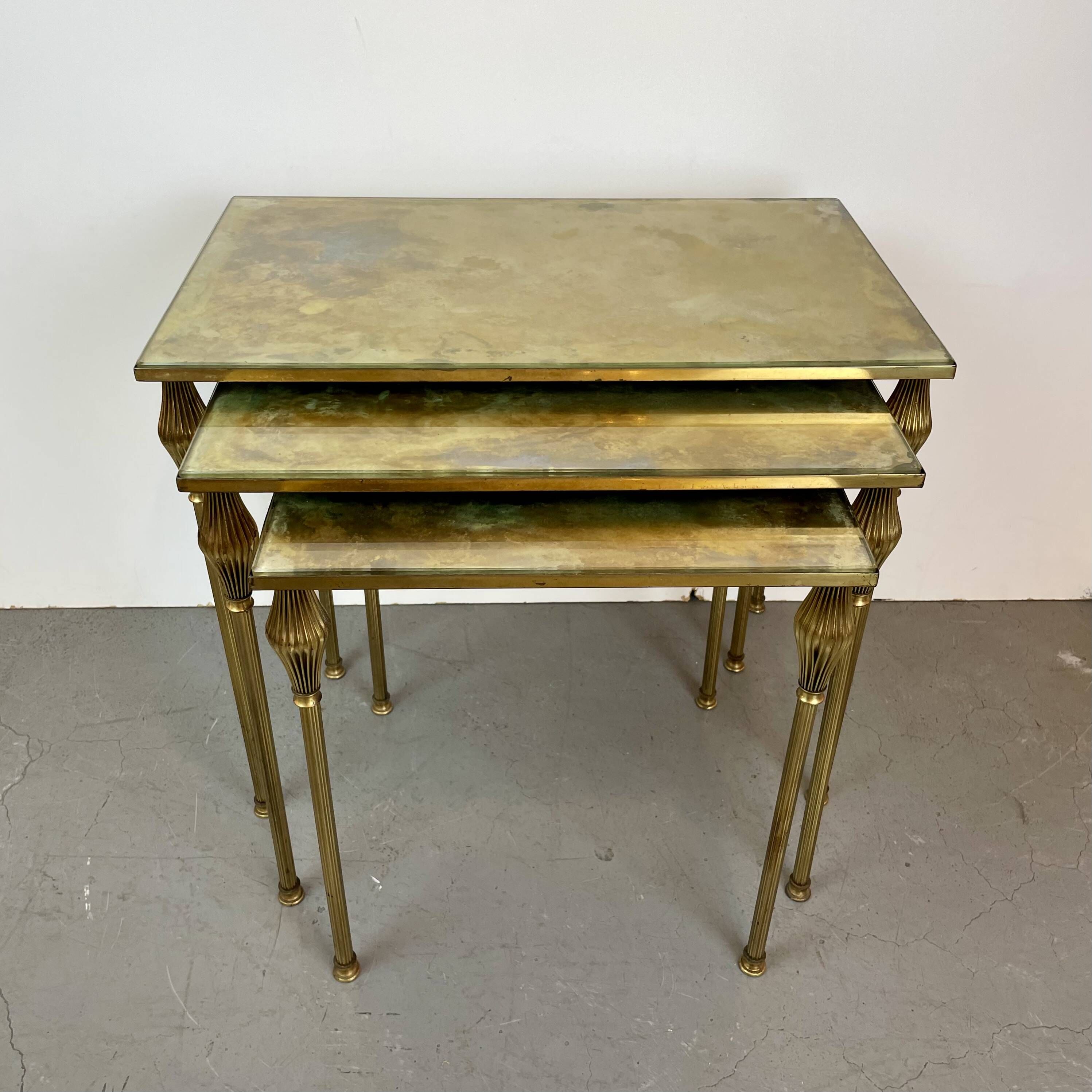 Nested brass tables, attributed to Maison Baguès, France, 1950–60.