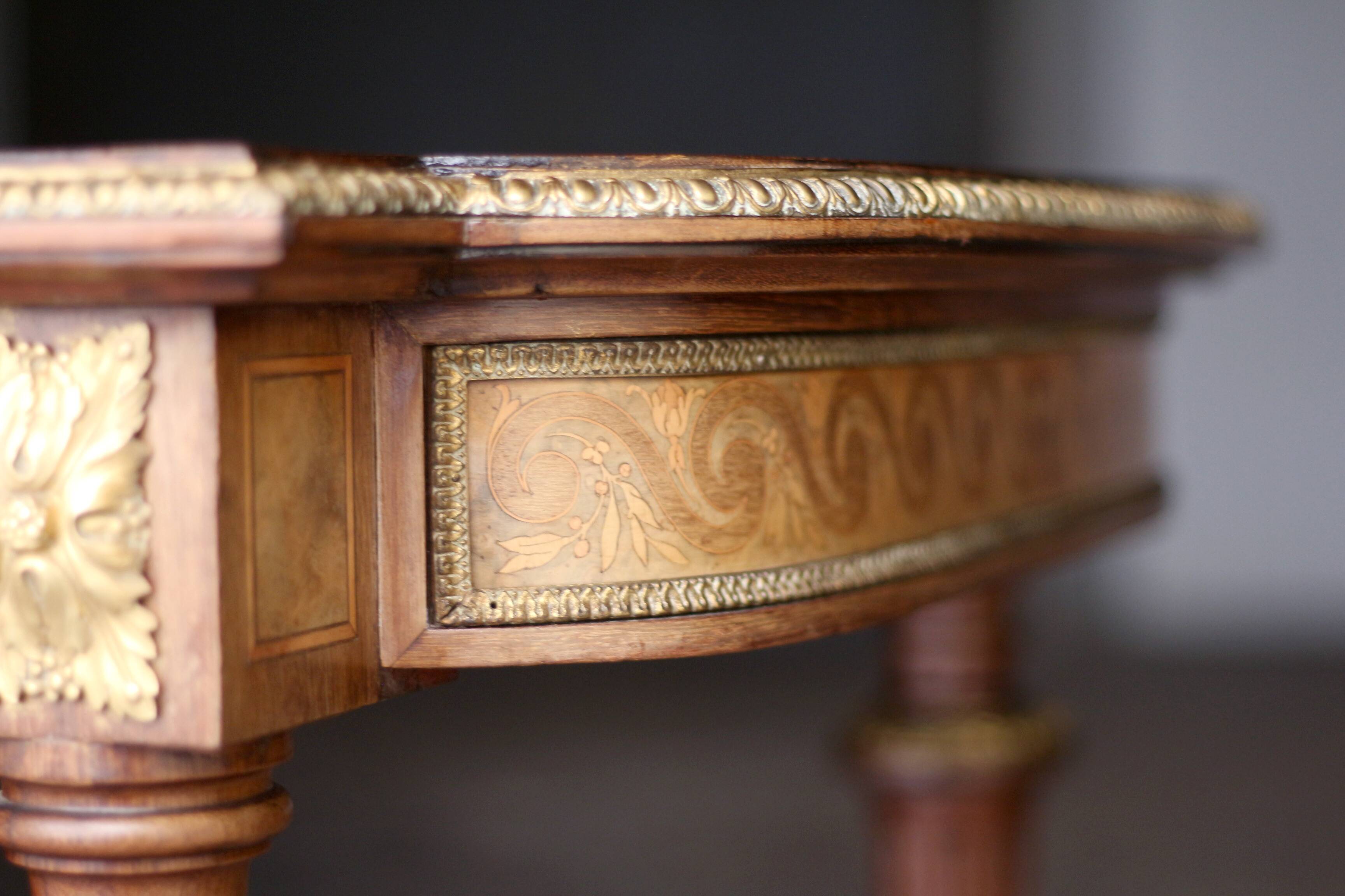 Superb Napoleon III table. Marquetry top and gilded bronzes.