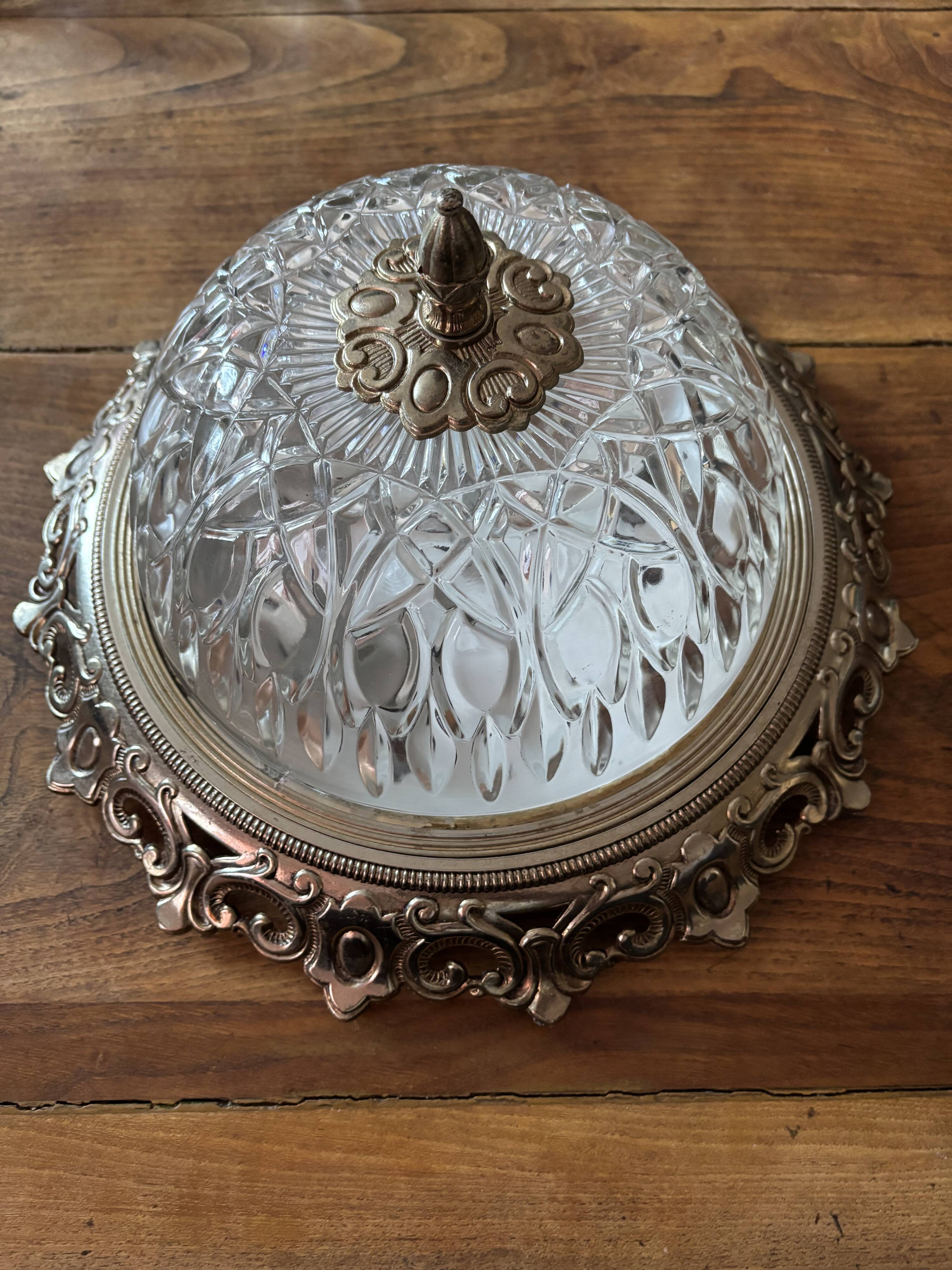 Gold ceiling light with chiseled glass globe