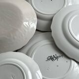 5 plates with colorful Sarreguemines floral designs.