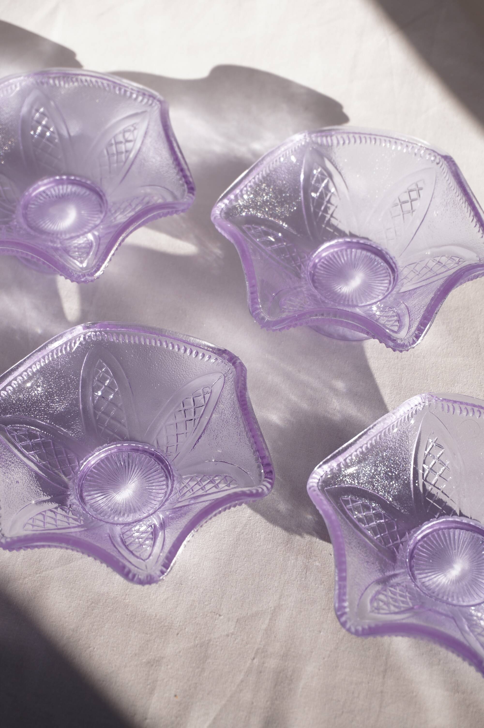 Set of 4 purple moulded glass ice cream bowls.