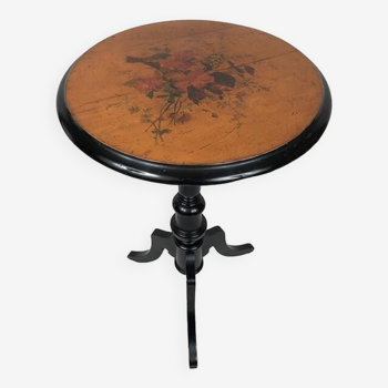 Black lacquered wood pedestal table and painted top decorated with flowers, late 19th century