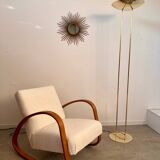 Old golden brass floor lamp with Italian design bulb from the 70s vintage