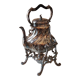 Ancient samovar tea fountain in silver metal