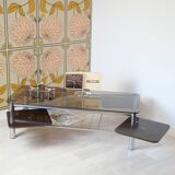 Chrome metal coffee table with smoked glass top.
