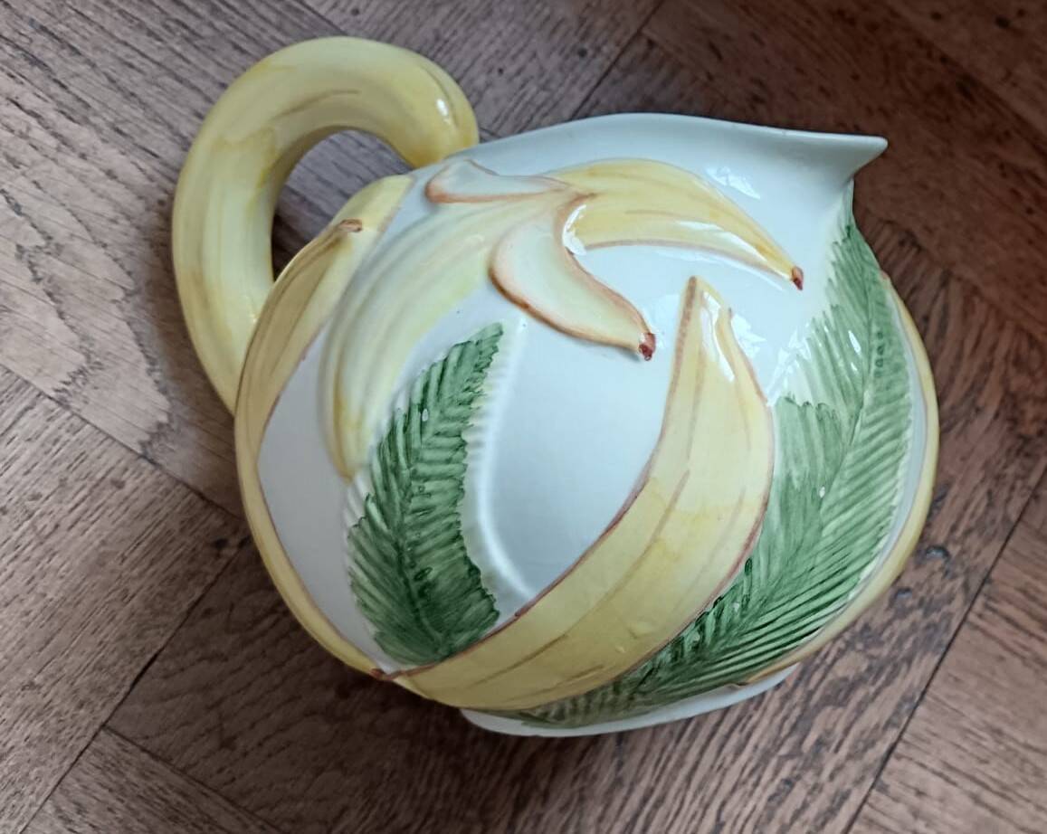 Jug in earthenware with banana decoration.