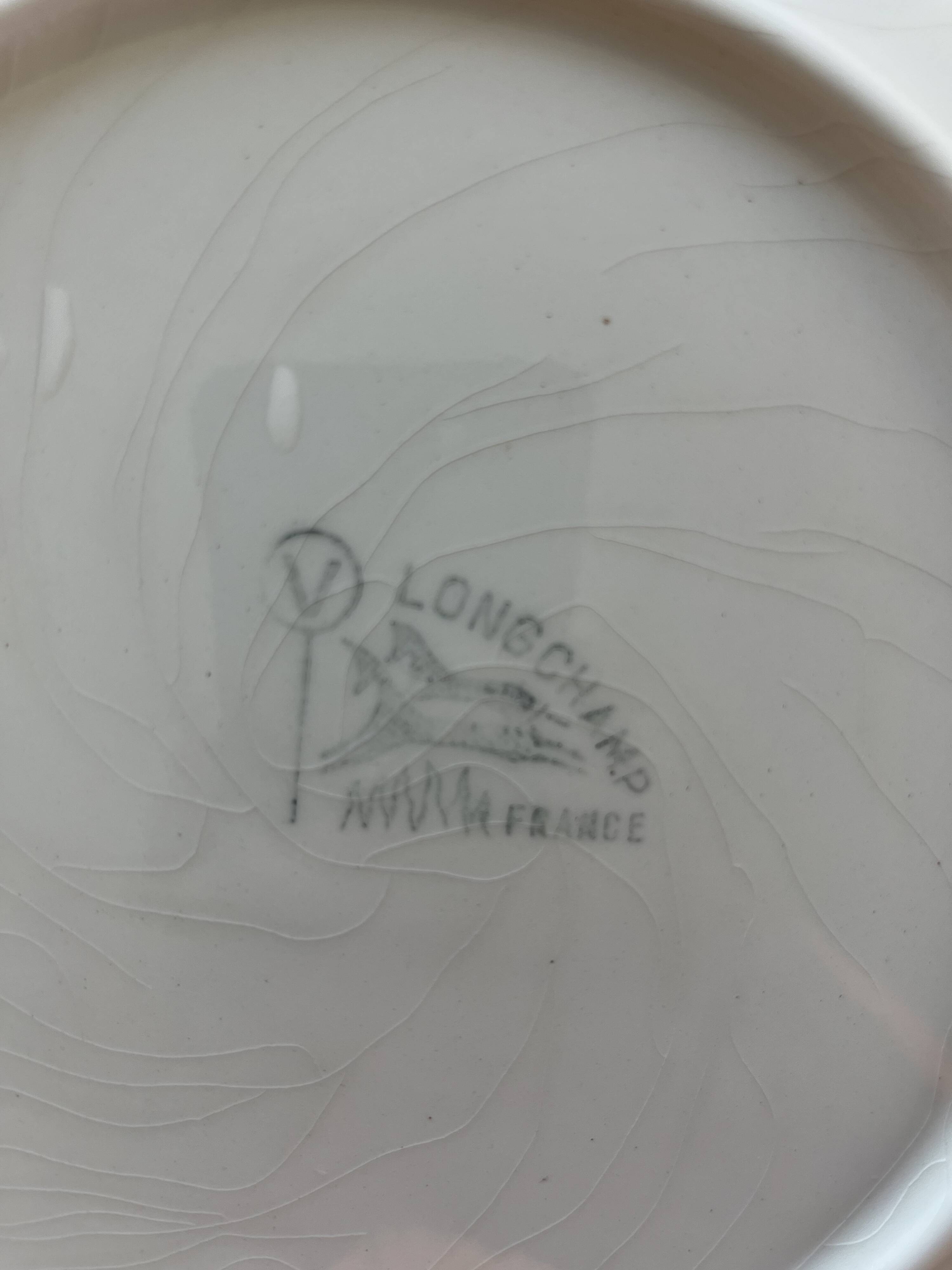 Ensemble de 12 assiettes de la série "Poisson" de Longchamp