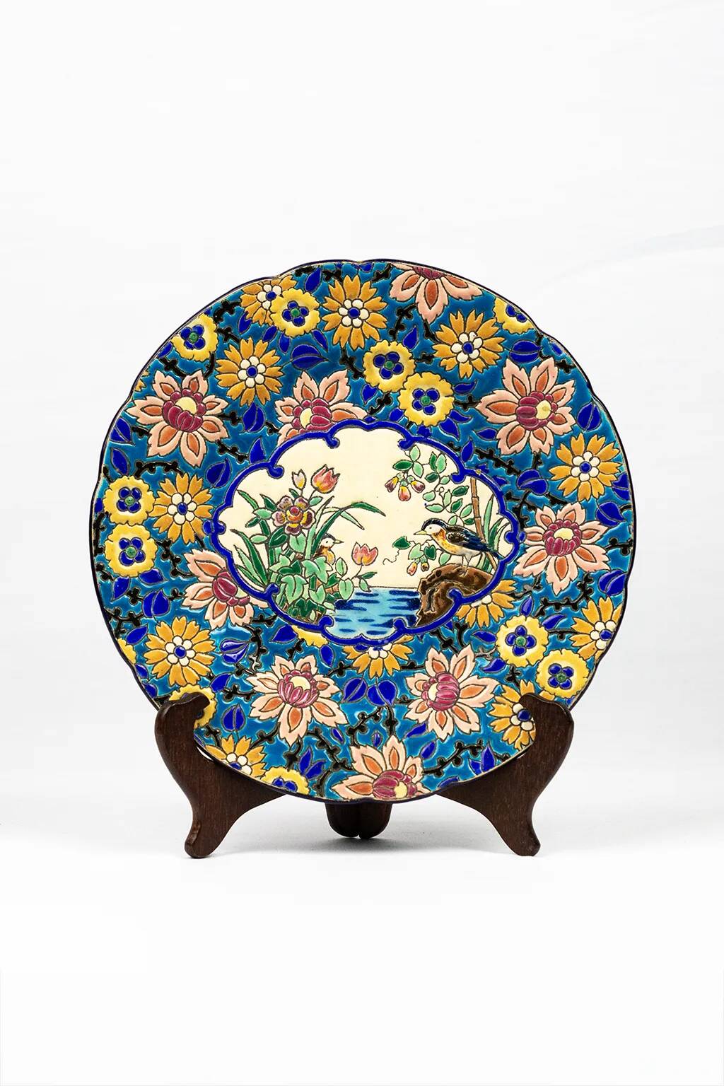 Assiette Longwy 1930 – Émaux à décor d’oiseaux et fleurs oranges