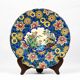 Assiette Longwy 1930 – Émaux à décor d’oiseaux et fleurs oranges