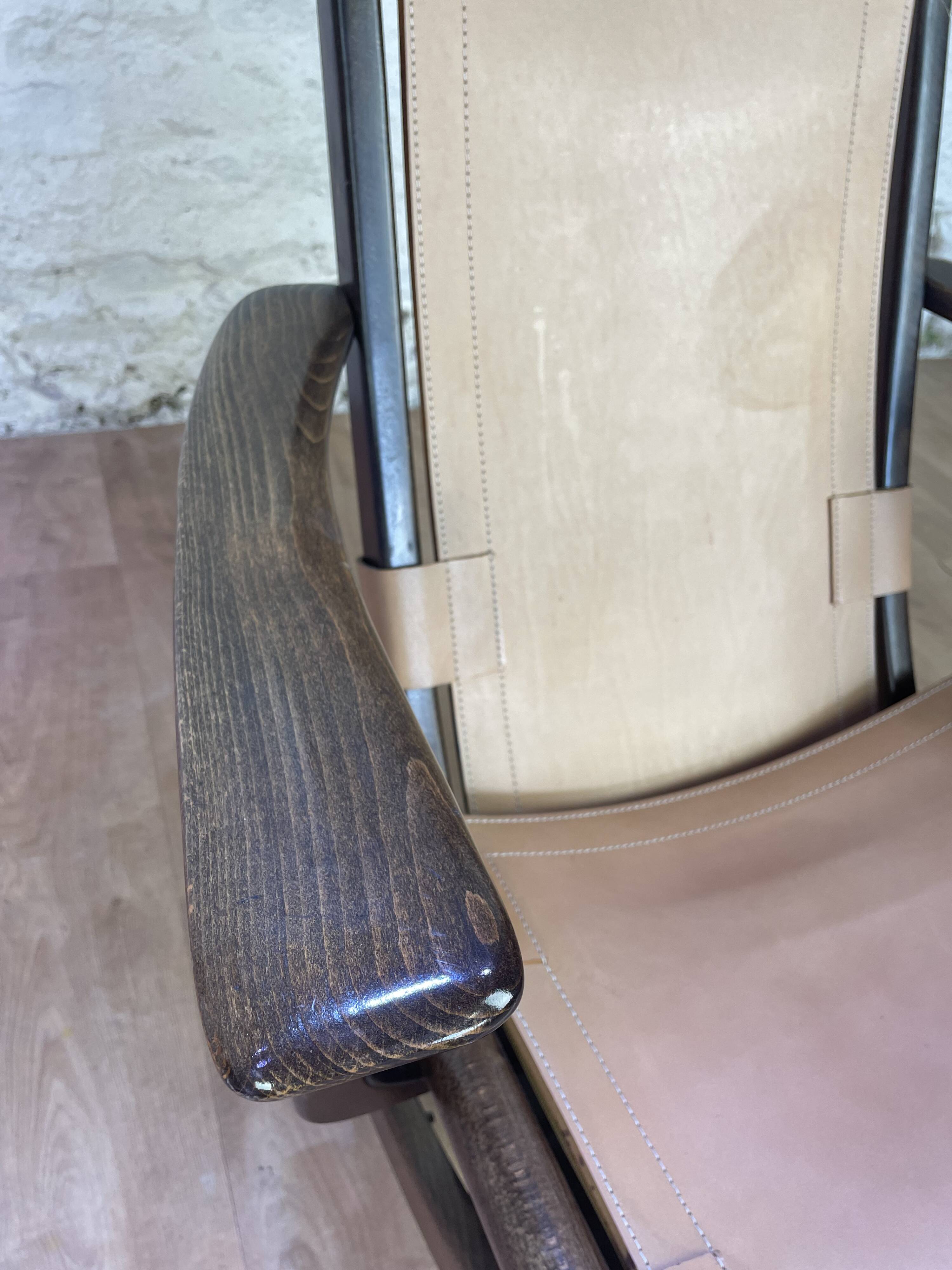 Colonial style leather armchair and ottoman