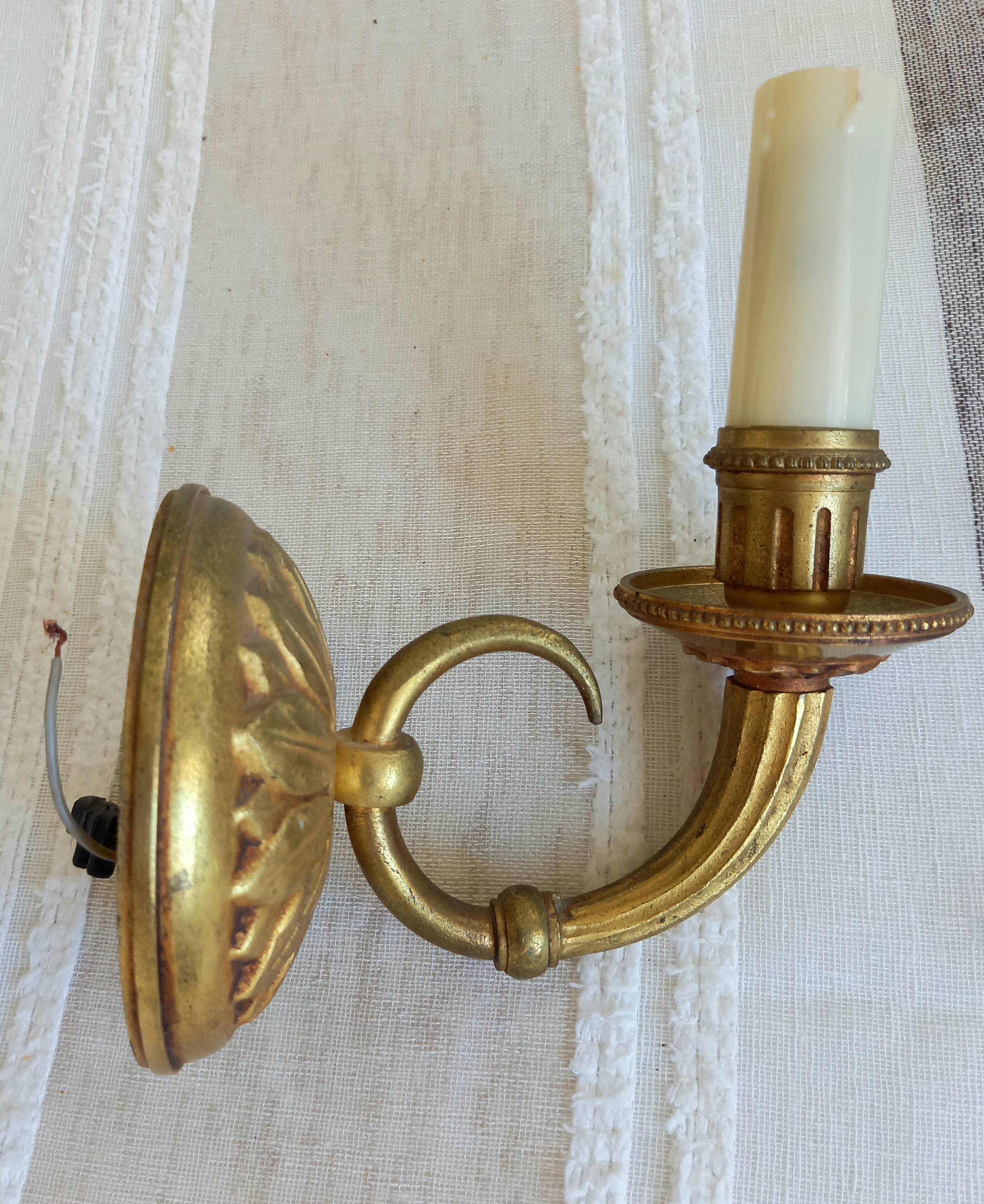 Electrified bronze gold wall sconces... in pairs.