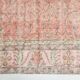 Tapis vintage à décor floral rouge et beige