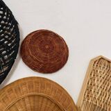 Wall composition of wicker baskets and trays.