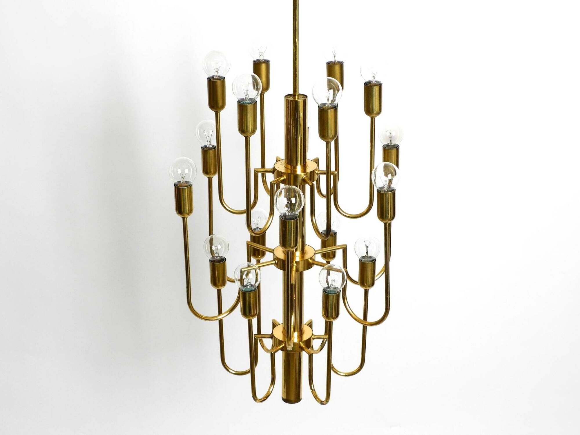 Three staged 18 arm Mid Century brass chandelier with a long brass rod