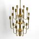Three staged 18 arm Mid Century brass chandelier with a long brass rod