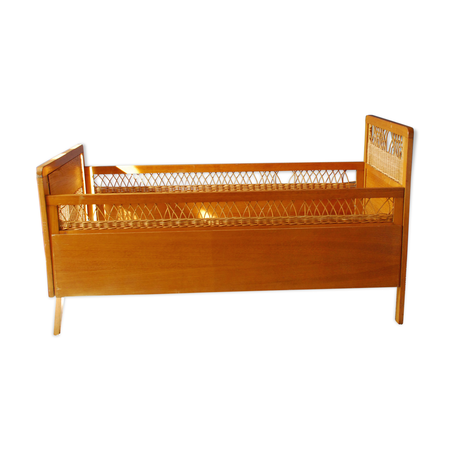 Wooden bed and vintage rattan