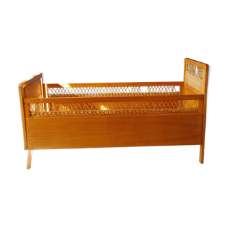 Wooden bed and vintage rattan